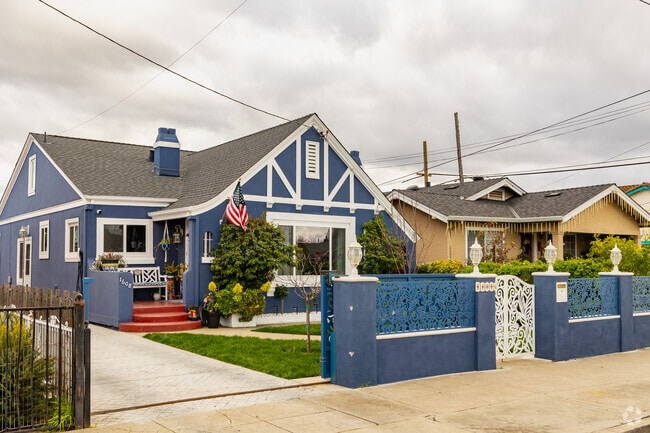 Most of the homes in the neighborhood are colorful single-story properties.