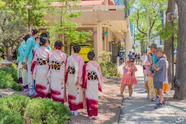 Traditionally dressed ladies of the Cherry Blossom festival pose in Central Business District.