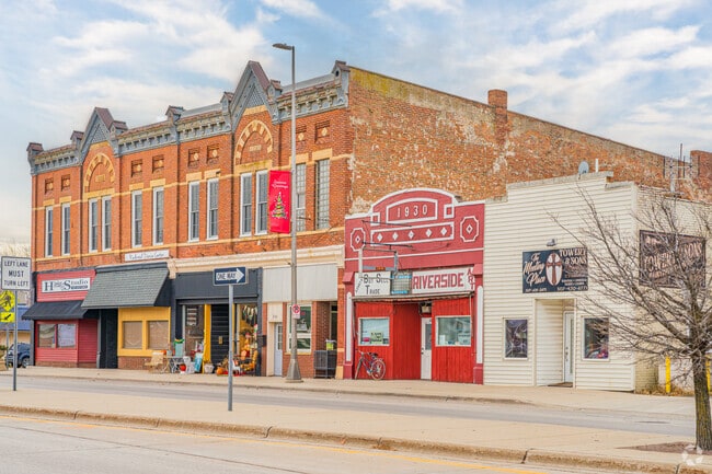 Visitors admire classic brick architecture in Redwood Falls’ historic downtown area.