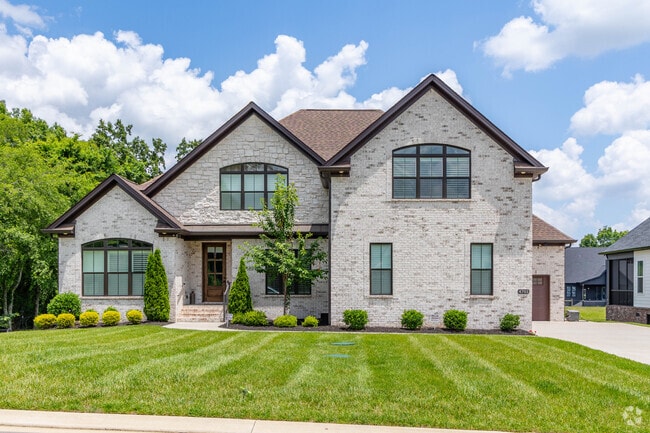 Large custom built homes have well manicured front yards in Smyrna.
