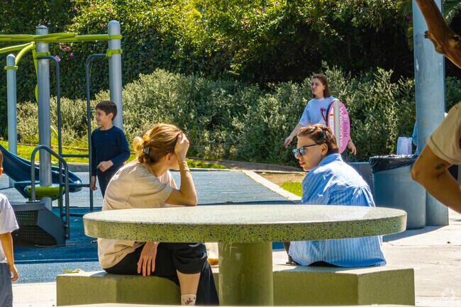 The playground at Palmer Park in Adams Hill has benches for parents to supervise children at play.