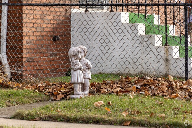 Residents of East Calumet enjoy decorating their lawns with statues of children.