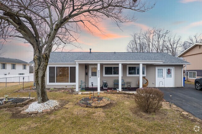 Many homes in Camelot like this ranch style are shaded by mature trees.