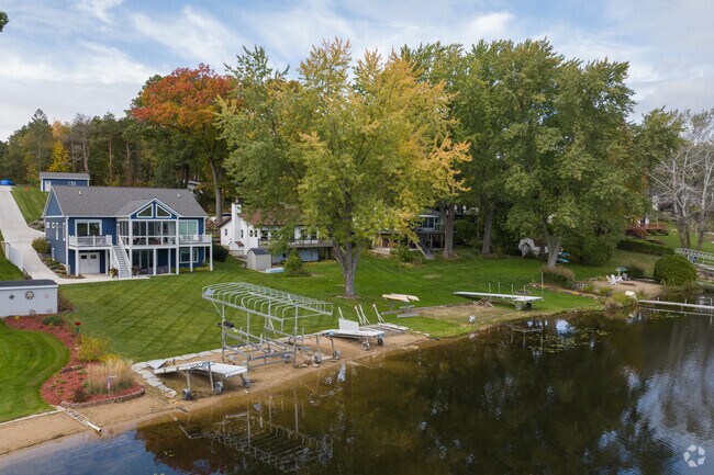 Two-story homes are rising along Big Pine Island Lake in Grattan Township.
