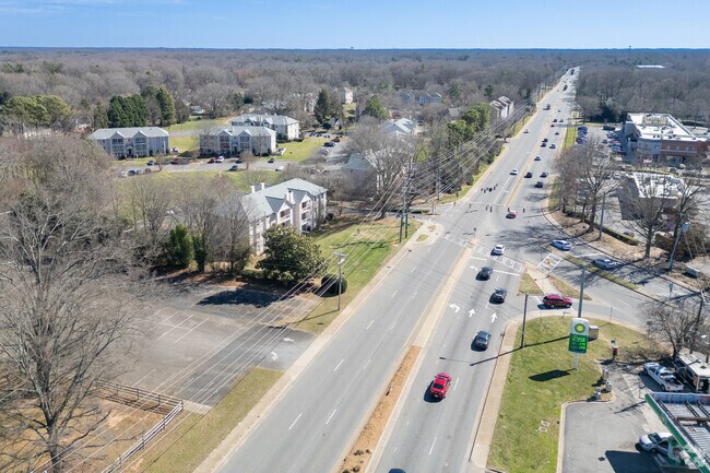 Cars zip along W. T. Harris Blvd, the heartbeat of Hickory Grove.