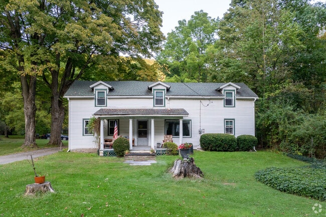 Homes in Phoenicia have wonderful lawns with well kept porches.