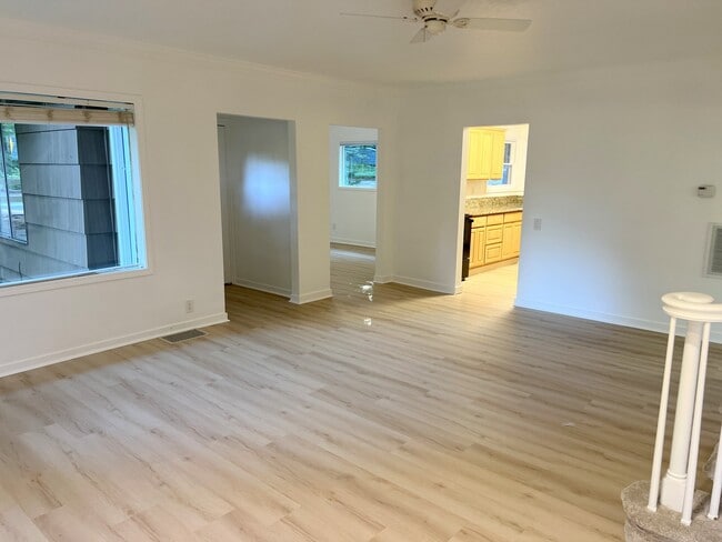 living room looking to flex room and main entry