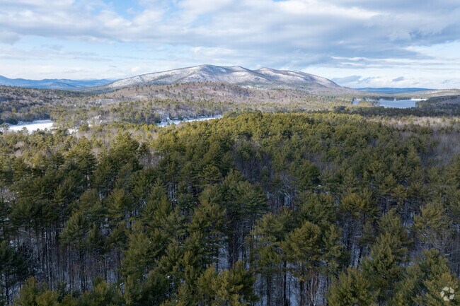 Pleasant Mountain towers gently behind Denmark, giving the town its signature scenic view.