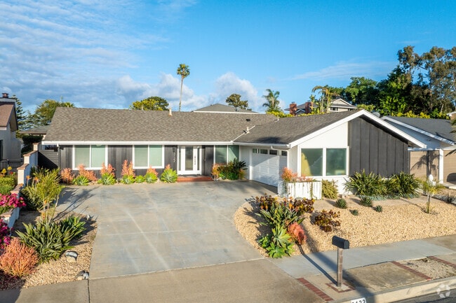 Top of the World features original-style and remodeled homes, such as this modern bungalow-style home.