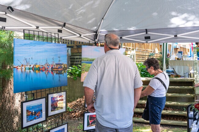 Cataumet residents take in images from JD's Photography.