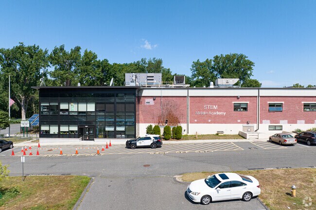 The front entrance to STEM Middle Academy has a unique glass design.