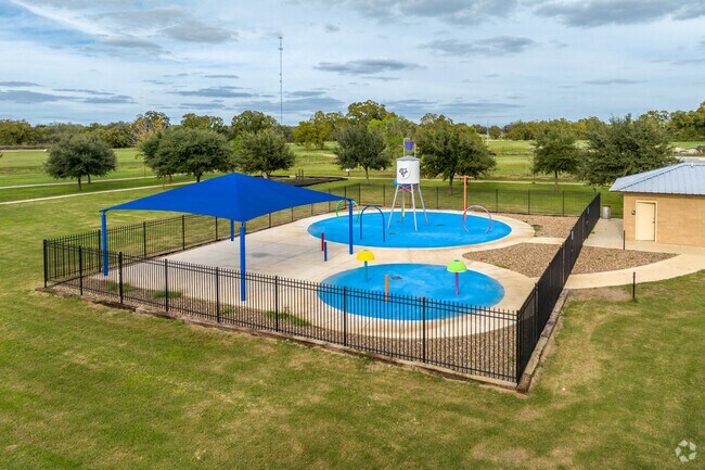 Stockdale Splash Pad Park's many water features include a dumping bucket and water cannons.