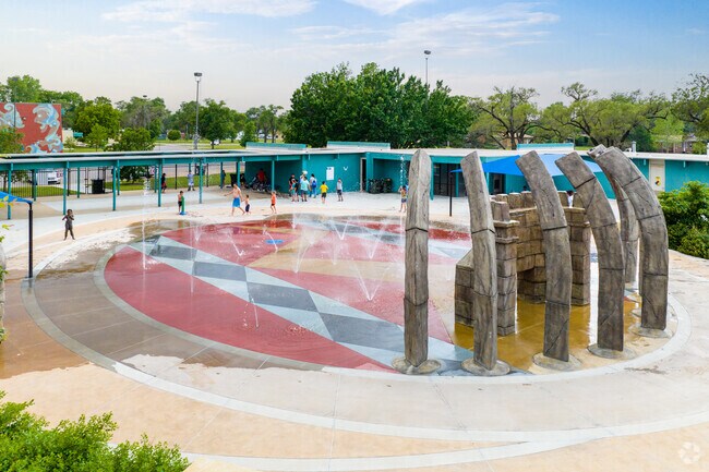 El Pueblo residents enjoy the splash pad located just outside of Evergreen Park.