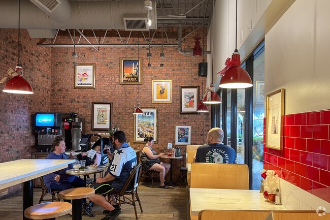 Guest enjoying the atmosphere in Le Petit Paris bistro in Monclair neighborhood.