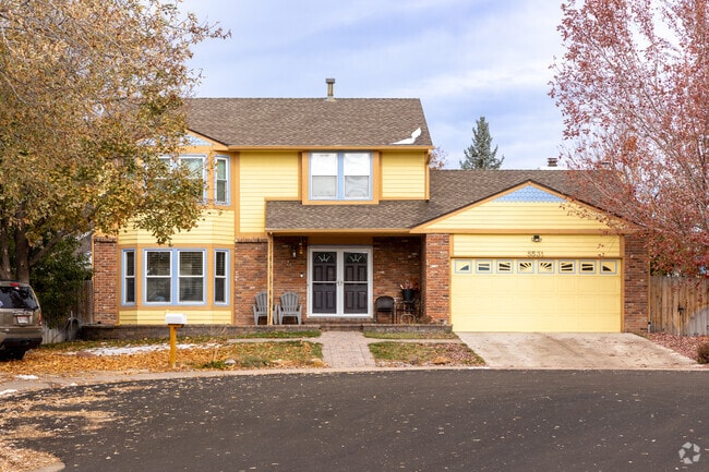 This classic two story home in Smoky Hill features an amazing bay window.