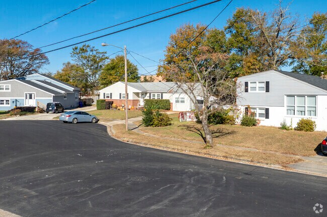 Unique homes line the streets of Camellia Shores, offering visual interest and variety.