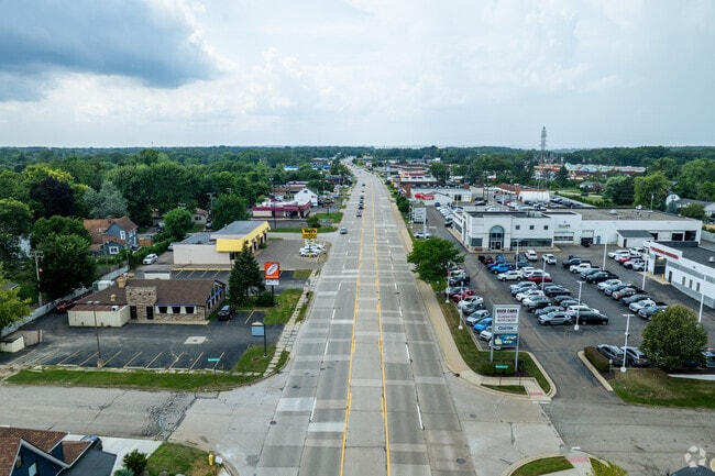 Shops and restaurants sit along Washtenaw Avenue, offering convenient retail and dining.