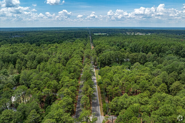 Knollwood Village is set amongst thick mature trees.