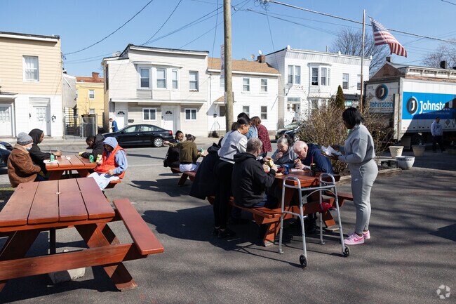 People enjoying a picnic and more outside in Cohoes, NY.