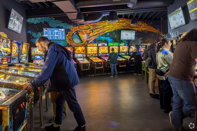 Night owls can beat their top score at LITT Pinball Bar.