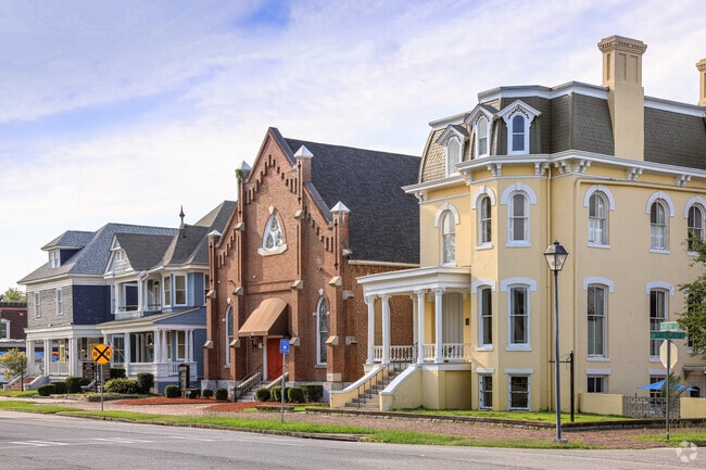 A row of varied home styles sits in Olde Town-Pinched Gut.
