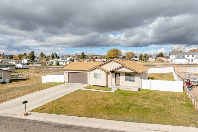 White backyard fences add charm to Soda Springs homes.
