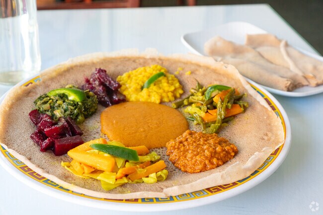 Savor authentic Ethiopian dishes at Abyssinia, a gem in Strivers' Row.
