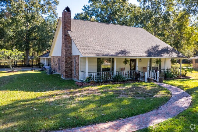 Zachary has acadian style homes with tall and short roofs.