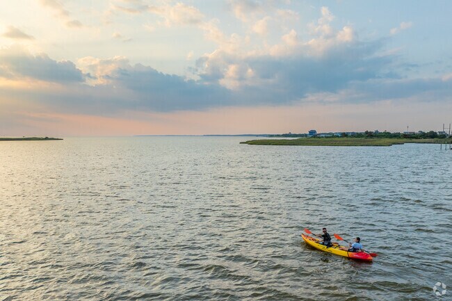 A sunset kayak trip on Roanoke Sound is a picturesque way to end the day in Whalebone Beach.