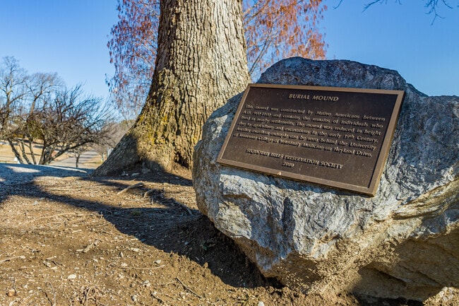 Plaque states the historical significance of Native Americans to Sequoyah Hills.