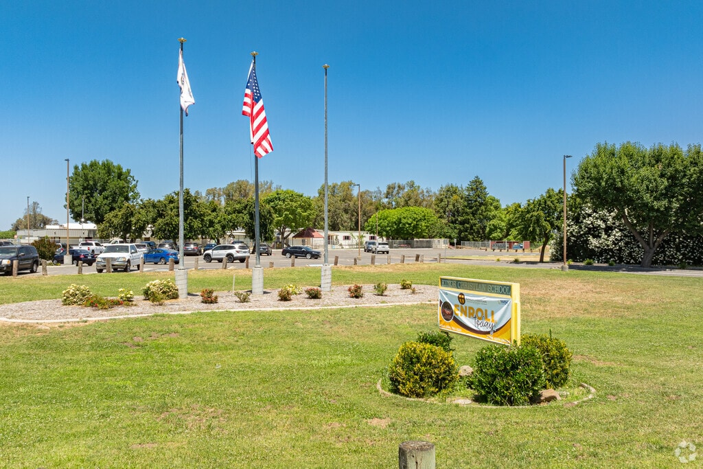 An American flag waves at the entrance to Kings Christian School in Lemoore.