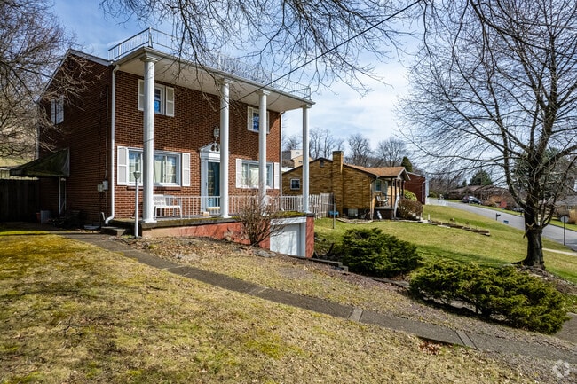 This Colonial Style home in McKeesport features columns on the front porch.