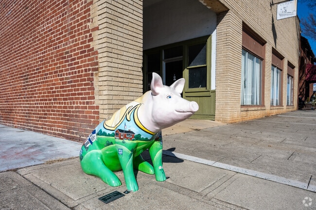 Pig statues painted by local artists dot the city as part of a public art initiative called “Pigs in the City.”