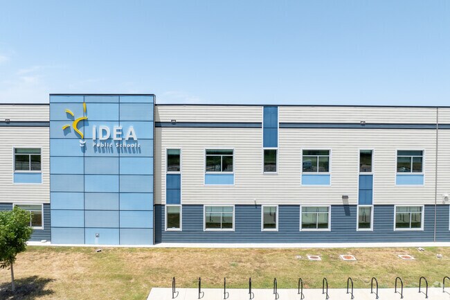 The exterior of Idea Edgecliff College Preparatory features the school's logo and modern design.