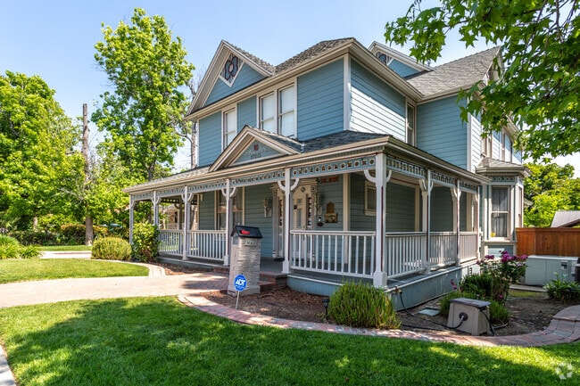 A meticulously maintained Victorian-style home enchants the Highland Historic District.