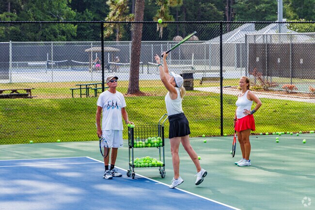Locals from Forest Hills South learn fundamentals at Althea Gibson Tennis Complex.