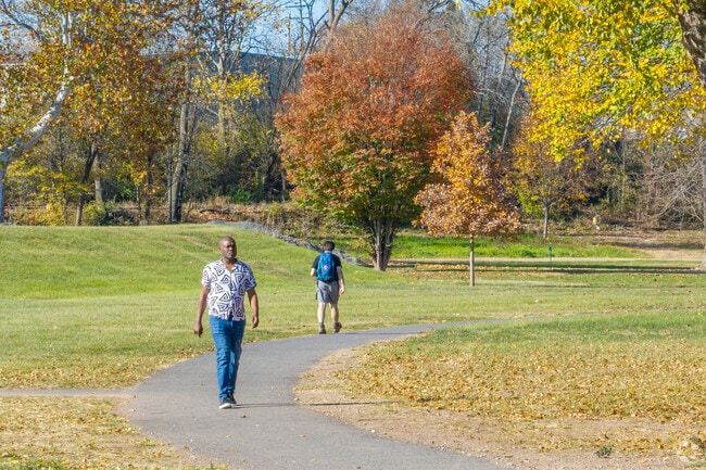 Memorial Park has a paved walking path that meanders throughout it.