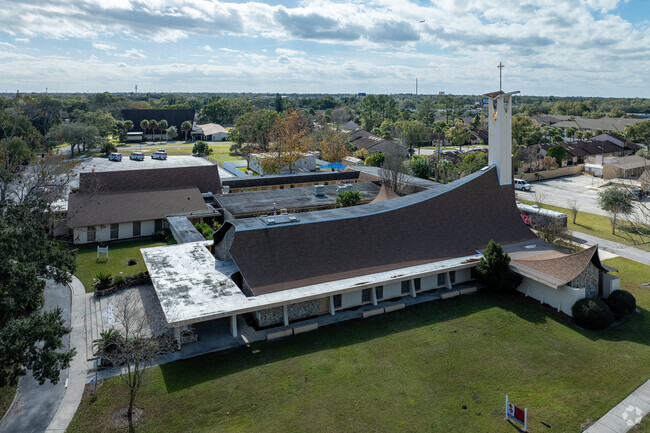 A large church with stunning architecture stands on the north side of Little Steps Academy.