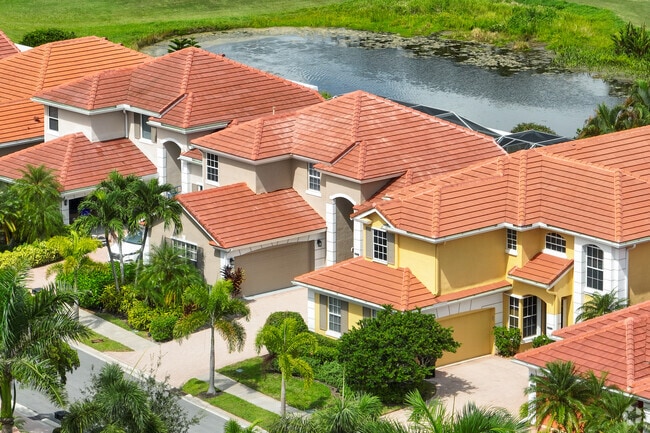 A picturesque row of Mediterranean-style homes brings warmth and elegance to The Acreage landscape.