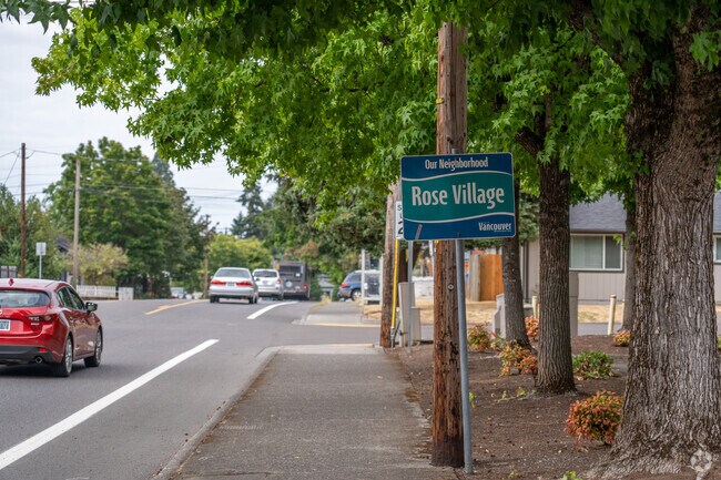 Signage welcomes you to the Rose Village neighborhood