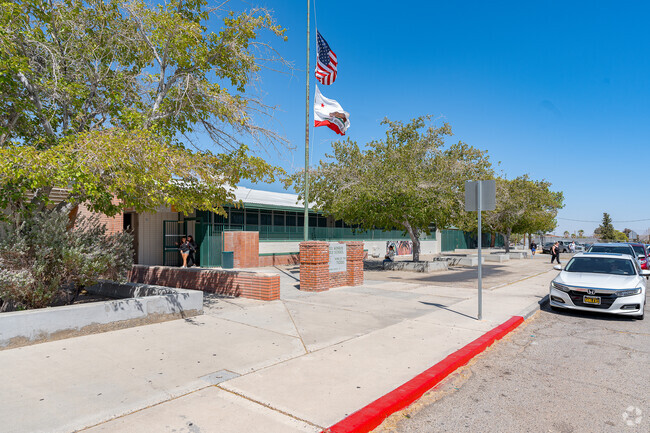 The flags fly high in front of James Monroe Middle School.