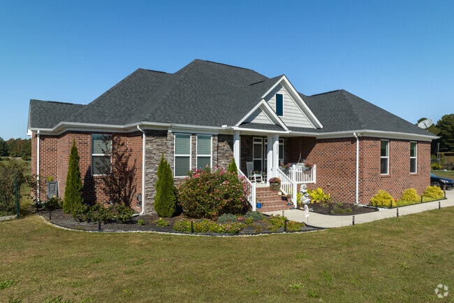 Pleasant Grove West includes homes with well-manicured yards and front porches.