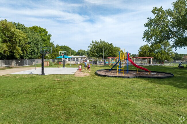 Kids climb on playground equipment at Rockwood neighborhood park.