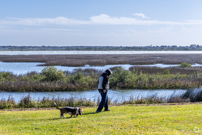 Walk the water's edge with your best friend in St. Augustine Shores.