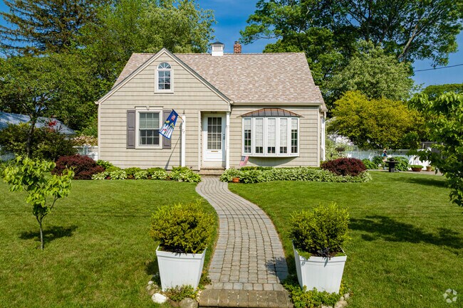 Check out this cute Cape Cod in Village of the Branch.