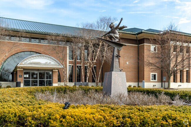 A statue placed outside the Clinton-Macomb Public Library