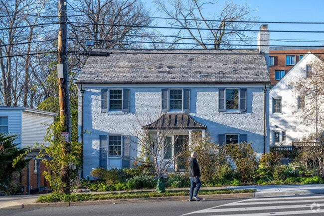 A white brick colonial home on 39th St NW in McLean Gardens.