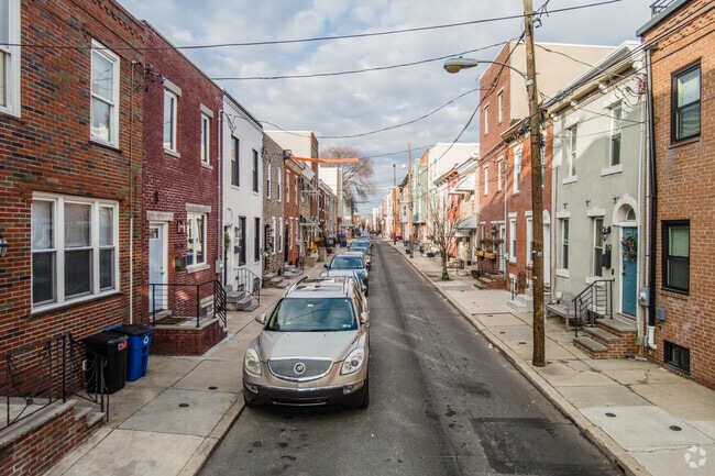 Many homes in Point Breeze are close together with street parking.