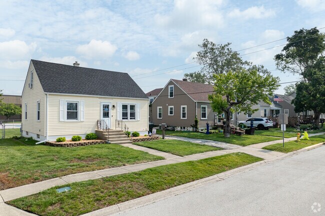 Manufactured homes come in modest sizes and boast grassy green front lawns in Manteno.
