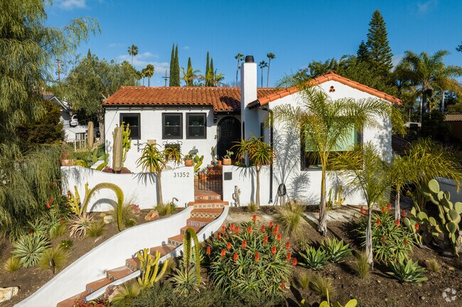 The smaller properties in the Los Rios Historic District exude charm with their rustic adobe walls, lush gardens, and inviting porches, creating a warm, storybook-like atmosphere in California’s oldest neighborhood.